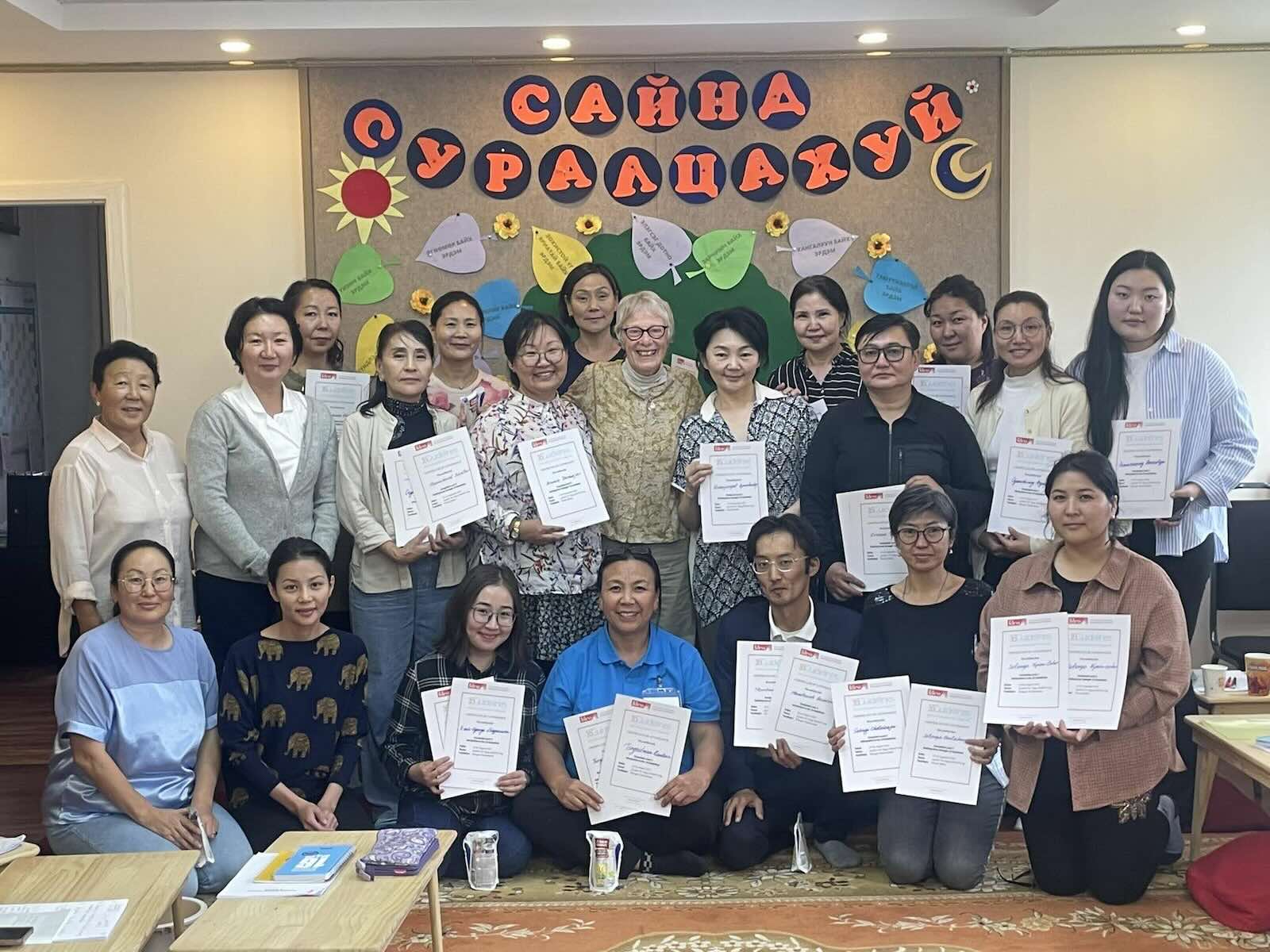 16G L2 participants in Mongolia holding their certificates at the end of the course.