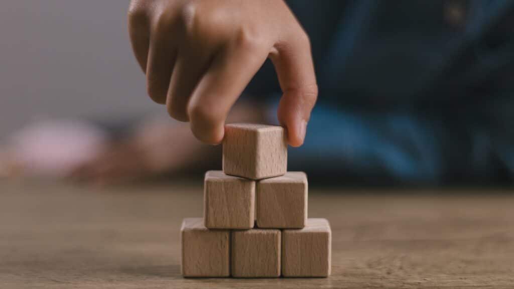 Blank wooden cubes on the table with copy space, empty wooden cubes for input wording, and an infographic icon.